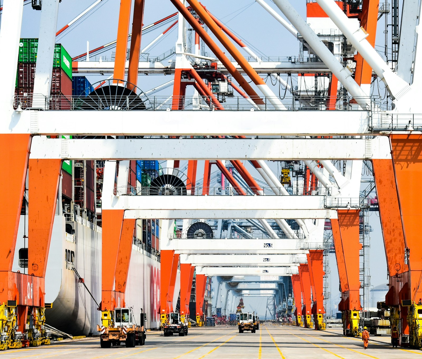Container port with cargo cranes and stacked containers